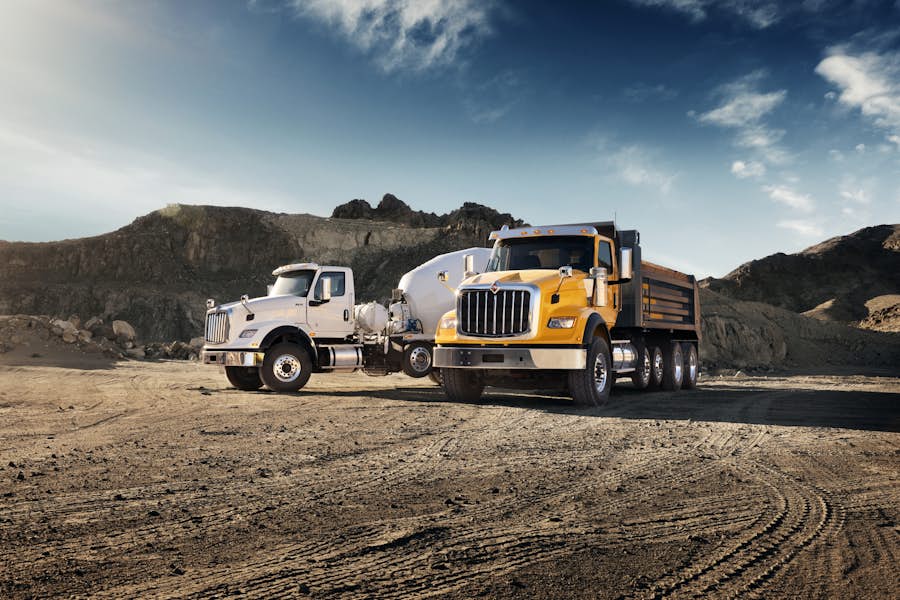 A large truck parked in a dirt area